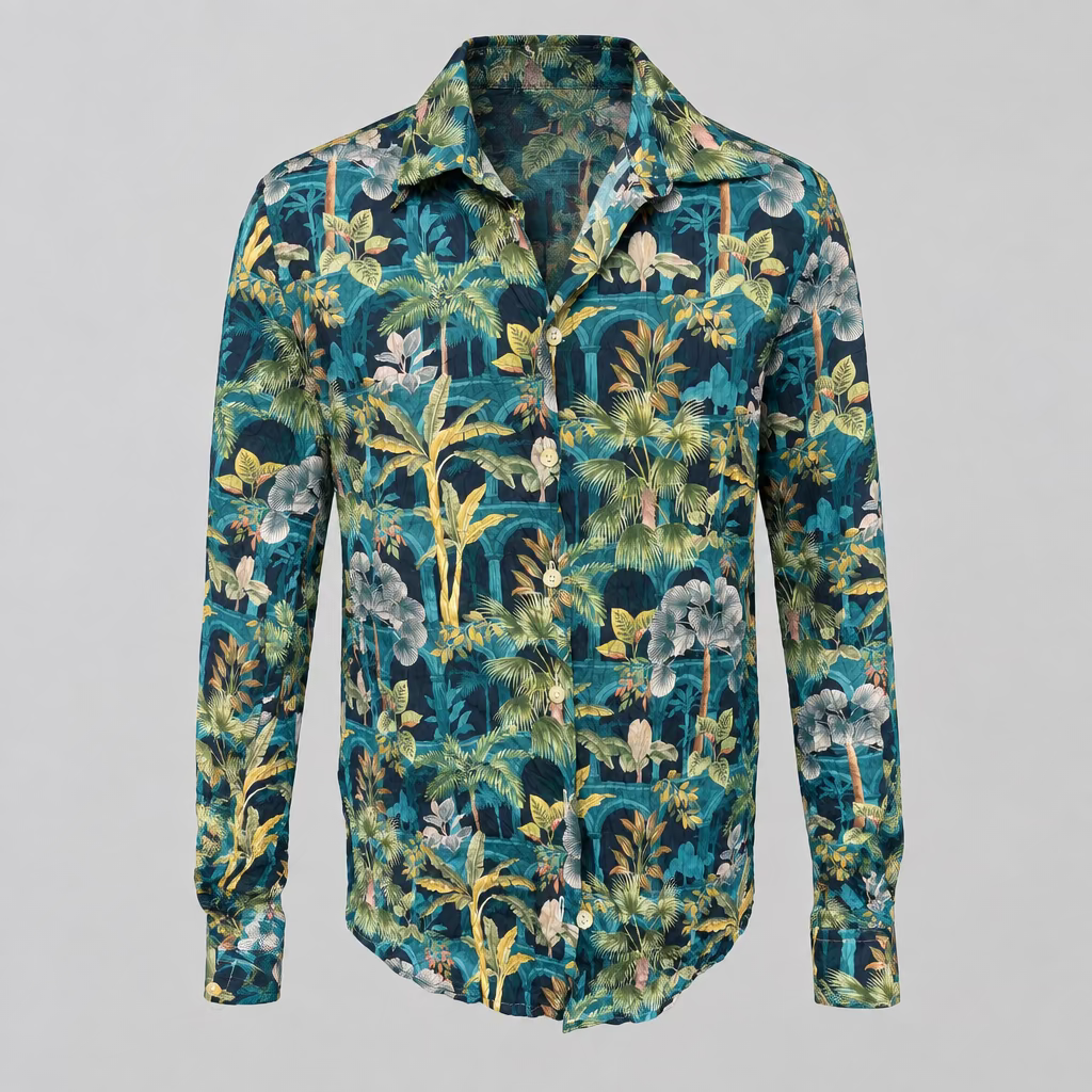 A long-sleeve button-up shirt with a dense tropical floral and palm leaf print in teal, green, navy, yellow, and white, displayed on a white mannequin torso in a boutique setting.