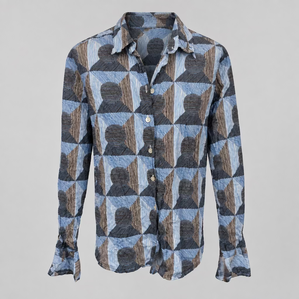 A long-sleeve button-up shirt with a geometric pattern of blue, gray, and brown textured shapes, displayed on a neutral light gray background.