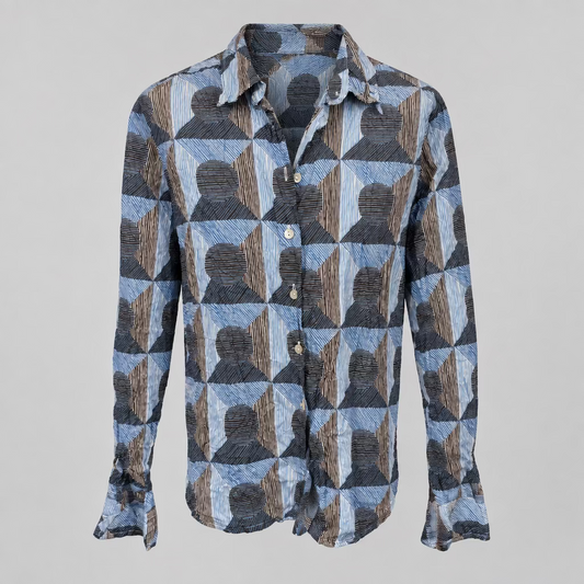 A long-sleeve button-up shirt with a geometric pattern of blue, gray, and brown textured shapes, displayed on a neutral light gray background.