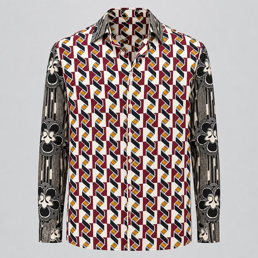 A long-sleeve button-up shirt with a bold geometric pattern in red, yellow, black, and white, displayed on a mannequin torso in a retail store setting.